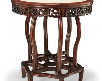 3203
A Chinese rosewood and stone entry table
20th century
The circular top with inset stone above an elaborately carved apron, raised on a tiered six-legged base joined by an elaborate stretcher
33" H x 31" Dia.
Estimate: $300 - $500