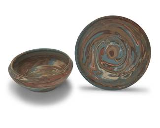 3311
Two Niloak pottery 'Mission Swirl' vessels
Early/mid-20th century; Eagle Pottery Company, Benton, AR
Each impressed: Niloak; tray stamped in ink: Patent No. 1657997
Comprising a footed bowl and a low tray
2 pieces
Bowl: 4" H x 10" Dia.; Tray: 1.25" H x 11.25" Dia.
Estimate: $500 - $700
