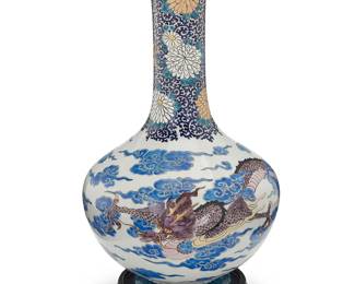 3250
An East Asian polychrome porcelain vase
20th century
The stick-neck enameled vase depicting floral motifs to neck above a dragon within clouds to the body, set on a carved wood stand
Vase: 18.75" H x 10.5" Dia.; Stand: 1.75" H x 7.875" Dia.
Estimate: $100 - $200