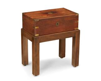 3095
An English brass-mounted rosewood box on stand
Early 20th century
The box with hinged top revealing a blue leather inset writing surface and a fitted interior with multiple cubbies and a pen holder, set on a later wood stand
Box: 5.75" H x 15.75" W x 9.5" D; Overall: 18.75" H x 16.5" W x 10.5" D
Estimate: $300 - $500