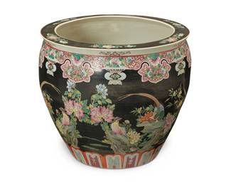 3142
A Chinese polychrome porcelain fish bowl
20th/21st century
The exterior depicting floral arrangements and phoenixes on a black ground, the interior depicting goldfish and underwater plants
18.25" H x 21.5" Dia.
Estimate: $200 - $400