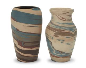 3312
Two Niloak pottery 'Mission Swirl' vases
Early/mid-20th century; Eagle Pottery Company, Benton, AR
Each impressed: Niloak; one with applied partial factory sticker
One with a flared rim
2 pieces
Taller: 6.75" H x 4" Dia.; Flared: 6.5" H x 3.375" Dia.
Estimate: $400 - $600