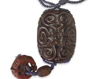 3224
A Japanese carved guri lacquer inro
Edo Period (1603-1868) or later
Carved with a swirling pattern and carved nut ojime and netsuke, fastened with later cord
Inro: 2.375" H x 1.625" W x 0.875" D; Overall: 6.25" L
Estimate: $300 - $500