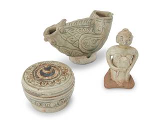3239
A group of Southeast Asian glazed ceramic items
15th century or later
Possibly Thai Sawankhalok wares, comprising a lidded jar, a bird-form effigy vessel, and a torso
3 pieces
Bird: 3.5" H x 5.75" W x 2.875" D; Figure: 3.625" H; Jar: 2.75" H x 3.125" Dia.
Estimate: $300 - $500