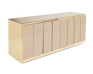 3294
A Modern Ello-style buffet
Late 20th/early 21st century
The mirror-topped and gold-toned metal-clad console with four mirror-front cabinet doors revealing a single shelf to each side and a small drawer to one side lined in silver cloth
30.25" H x 72.5" W x 20.5" D
Estimate: $300 - $500