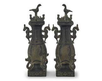 3187
A pair of Chinese archaistic-style metal covered urns
20th century or earlier
Each incised with inscription at neck
Each lidded urn with bird and beast figural handles, lid finials, and accents to base in high relief, the body decorated with more figures in low relief among a meandering ground
2 pieces
Each: 19" H x 7.5" W x 6.25" D
Estimate: $300 - $500