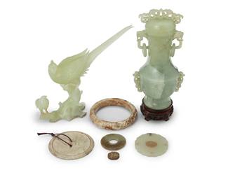 3163
A group of Chinese carved hardstone items
20th century
Comprising a jade covered urn set on a hardwood stand, a jade bird figural group, a jade Pi disc pendant, a hardstone mirror back, a hardstone bracelet, a hardstone ring, and hardstone beetle seal
7 pieces
Urn: 7" H x 3.75" W x 2.625" D; Birds: 6.5" H x 7.5" W x 2.25" D; Medallion: 2.25" Dia.
Estimate: $700 - $900
