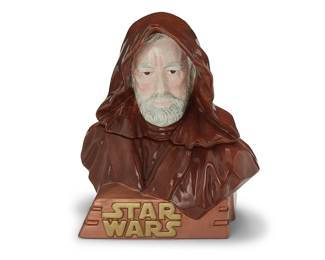 3314
A Star Wars ceramic Obi Wan Kenobi cookie jar
Late 20th century
Edition: 932/1000
Numbered and inscribed to underside: Star Limited Editions Jars / 026 / Treasure Craft / A Pfaltzgraff Company / Obi Wan Kenobi / TM & © Lucasfilm Ltd.
The enameled ceramic figural lidded jar depicting Star Wars character Obi Wan Kenobi
14.75" H x 13.5" W x 10.5" D
Estimate: $200 - $300