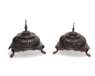 3254
A pair of Burmese Hsun Ok offering jars
20th century
Each tripod lidded bowl with lobed cover and turned finial above an openwork apron, black lacquered to exterior and red to interior
2 pieces
Each: 23.75" H x 25" Dia.
Estimate: $150 - $250
