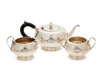 3014
An American sterling silver tea service
Mid-20th century
Each marked for sterling
Comprising a teapot with enameled wood handle (4.625" H x 9.625" W x 5.625" D), a creamer (3.625" H x 5" W x 4" D), and an open sugar (3.25" H x 5.375" W x 4" D)
3 pieces
Total weight: 21 gross oz. troy approximately
Estimate: $400 - $600