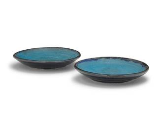 3286
Otto Heino (1915-2009)
Two glazed studio pottery plates, 1999
Each incised to underside: Otto / [artist's cipher] / 99
Each with a cerulean blue glaze to well
2 pieces
Larger: 1.375" H x 7.375" Dia.; Smaller: 1.25" H x 7.125" Dia.
Estimate: $400 - $600