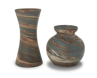 3313
Two Niloak pottery 'Mission Swirl' vases
Early/mid-20th century; Eagle Pottery Company, Benton, AR
Each impressed: Niloak
Comprising an hourglass vase and a globular vase
2 pieces
Hourglass: 8.125" H x 4.125" Dia.; Globular: 5.625" H x 5.625" Dia.
Estimate: $500 - $700