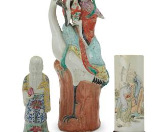 3148
Three Chinese polychrome porcelain items
20th century
Taller figure impressed with Chinese inscription
Comprising a female figure with a Manchurian crane (15" H x 5.875" W x 3.75" D), an old man depicted holding a peach (8.5" H x 2.375" W x 2.375" D), and a curved plaque depicting three figures (7" H x 2.625" W)
3 pieces
Estimate: $200 - $300