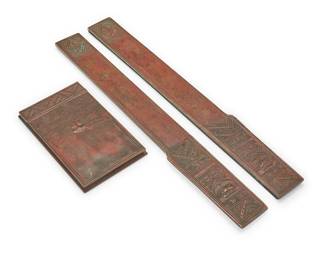 3036
A Tiffany Studios bronze 'American Indian' partial desk set
Early 20th century
Each marked: Tiffany Studios / New York; and variously numbered: 1181 / 1188
The patinated bronze items comprising a paper pad holder and two blotter ends
3 pieces
Pad holder: 7.625" H x 4.75" W x 0.625" D; Each blotter end: 19.375" H x 2.375" W
Estimate: $300 - $500