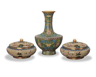 3189
A group of Chinese cloisonné vessels
20th century
The polychrome enameled gilt copper vessels, comprising a vase and a pair of lidded low jars
3 pieces
9.375" H x 6.125" Dia.; Each jar: 3.875" H x 6.125" Dia.
Estimate: $200 - $300