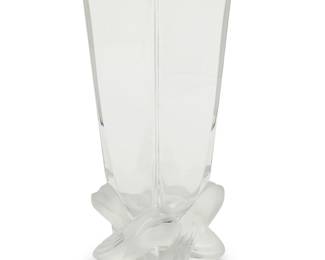 3026
A Lalique glass 'Lucca' vase
Late 20th/early 21st century
Etched: Lalique ® France [post-1978]; numbered illegibly; with applied Lalique factory sticker
With frosted ribbon-form base
11" H x 3.875" W x 3.875" D
Estimate: $300 - $500
