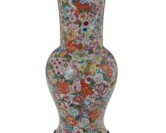 3139
A Chinese porcelain millefleurs vase
20th century
Bearing an apocryphal reign mark for Qianlong Period (1736-1795)
The baluster-form vase with wide flared rim, profusely decorated in floral motifs, set on a hardwood stand
Vase: 17.5" H x 9.375" Dia.; Overall: 19.25" H
Estimate: $250 - $350