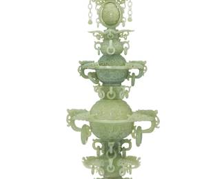 3160
A Chinese carved jade three-tiered censer
20th century or earlier
The elaborate censer in three sections, each carved with dragon-form handles, ring accents, and floral elements, the topmost section with a spinning egg element, all raised on a wood stand and set in a custom formed box
Overall without stand: 31" H x 12" W x 7.125" D; Box: 9" H x 32.75" W x 16.5" D
Estimate: $500 - $700