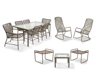 3354
A suite of Brown Jordan 'Tamiami' patio furniture
Mid/late 20th century
Chairs and rockers with faded sticker: Brown Jordan; chairs variously numbered
Each brown powder-coated aluminum, comprising four side chairs (29.5" H x 17.5" W x 24.25" D) and two armchairs (31" H x 23.25" W x 25.25" D), each with brown vinyl strapping, one rectangular patio table with inset Aqualite glass (25.25" H x 61.25" W x 35.25" D), a pair of rocking chairs (43" H x 21.75" W x 37" D), and a glass inset side table (14.75" H x 20.5" W x 20.5" D), together with two 'Lido' footstools (19" H x 21.5" W x 21" D)
12 pieces
Estimate: $700 - $900