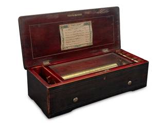 3044
A Nicole Freres six-air music box
19th century; Geneva, Switzerland
Marked: Nicole Freres / Geneve / 45755
The 108-note comb music box with Change/Repeat and Start/Stop switches, an 11" brass cylinder, and hand-written paper label to lid with music selection, housed in a wood case with marquetry lid
5.5" H x 19.375" W x 8.5" D
Estimate: $400 - $600