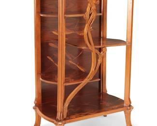 3073
A Gallé-style marquetry étagère
20th century
The Art Nouveau-style wood display table with three tiers of half-length shelves, featuring marquetry butterfly and floral motifs
56" H x 35.5" W x 20.5" D
Estimate: $500 - $700