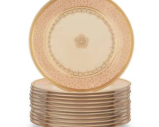 3053
A set of twelve Cauldon porcelain dinner plates
Late 19th century, retailed by Davis Collamore
Each marked verso: Cauldon Ware / T.C. Brown Westhead Moore & Co. / Staffordshire / England / Davis Collamore & Co / 921 Broadway / New York; each with painted number verso: H 5304
Each with pink and gold floral 'cherry blossom' decoration to the lip and gold scrollwork to the well center and edge, with gold fretwork band to rim edge
12 pieces
Each: 10.375" Dia.
Estimate: $250 - $350