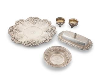 3008
A group of sterling silver repoussé table items
Early 20th century
Each marked for sterling and various makers
Comprising a Reed & Barton 'Frances I' sandwich tray (11.375" Dia.), a Fisher lidded butter tray (2.875" H x 8.875" W x 4.5" D), a pair of W. Gale & Sons master salts with gilt-washed interiors (2.5" Dia.), and a small Stieff bowl (5.5" Dia.)
5 pieces
Total weight: 29.5 oz. troy approximately
Estimate: $800 - $1,200