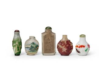 3152
Five Chinese glass snuff bottles
20th century
Comprising two interior-painted glass bottles and three overlay glass bottles, one overlaid with three colors and carved with bats and clouds on a white ground, another with green overlay carved with vines and gourds on a white ground, and the last with red blossoming branches
5 pieces
Tallest: 3" H; Shortest: 2.25" H
Estimate: $400 - $600