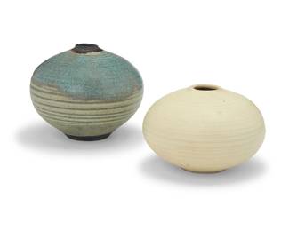 3285
Otto Heino (1915-2009)
Two glazed studio pottery bud vases, 2000-2005
Each with incised signature and date to underside: Otto / [artist's cipher]
One with a cream glaze and one pale blue
2 pieces
Cream: 3.25" H x 4.75" Dia.; Blue: 4.375" H x 5.125" Dia.
Estimate: $400 - $600