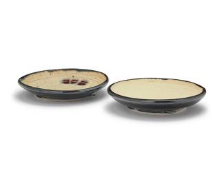 3287
Otto Heino (1915-2009)
Two glazed studio pottery plates, 2000
Each incised to underside: Otto / [artist's cipher] / 00
Each with a cream glaze to well
2 pieces
Larger: 1.25" H x 6.625" Dia.; Smaller: 1.375" H x 6.5" Dia.
Estimate: $400 - $600