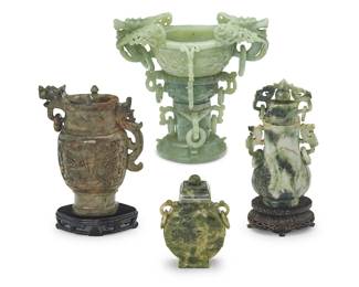 3166
A group of Chinese hardstone carvings
20th century
Comprising three hardstone urns with ring accents, two set on a carved wood stand, and a carved jade censer cup with opposed dragon handles and ring accents
4 pieces
Censer: 8.5" H x 9.375" W x 6.25" D; Smallest urn: 5" H x 3.625" W x 1.875" D
Estimate: $300 - $500