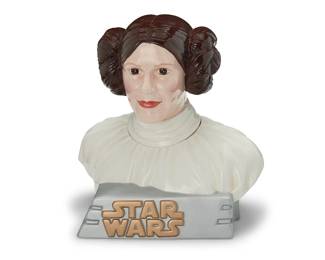 3315
A Star Wars ceramic Princess Leia cookie jar
Late 20th century
Edition: 150/1000
Numbered and inscribed to underside: Star Limited Editions Jars / 032 / Leeber Limited / Princess Leia / TM & © Lucasfilm Ltd.
The enameled ceramic figural lidded jar depicting Star Wars character Princess Leia
14.125" H x 12.75" W x 10.5" D
Estimate: $200 - $300