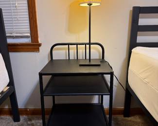 Two nightstands with lamps.