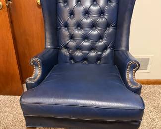 Two blue leather wingback chairs
