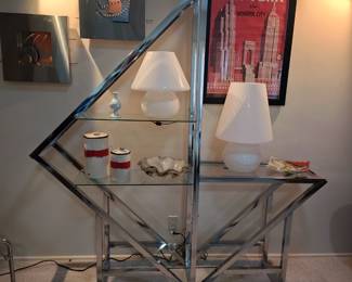 CHROME AND GLASS SHELVING UNIT NOT FOR SALE. STAYS W/ FAMILY.