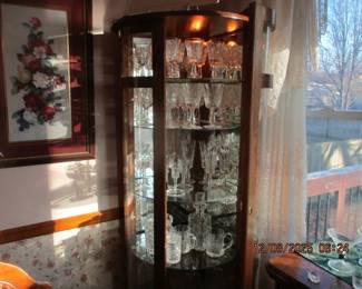 Corner curio cabinet filled only with Waterford Crystal