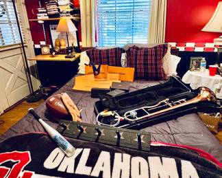 Bat, glove, football, trombone, headboard for double bed, 