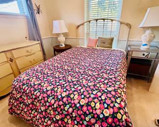 Double iron headboard and field of flowers comforter