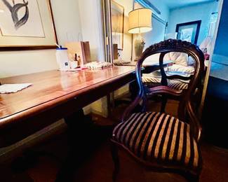 Writing desk, several occasional chairs, floral prints