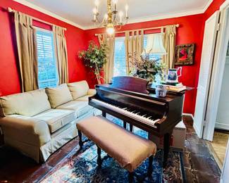 Grand piano, sofa, faux fiddle tree, Wedgwood  jasperware pitcher, gorgeous rug
