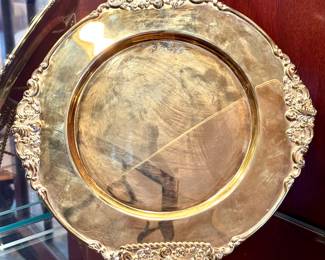 Set of 12 Godinger gold color chargers. $120.