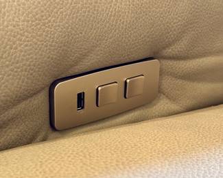 (Close up of gray leather dual-sided electric recliner with charging ports- 82”x39”x38”- $600- you move)