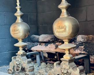 Pair of brass andirons with lion head motifs. 12x22”. $400.