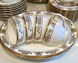 Wedgewood Clivedon China. Place settings for 12 in excellent condition. Additional pieces of 12 shrimp bowls, two vegetable bowls, platter, gravy boat and tray. $1000.