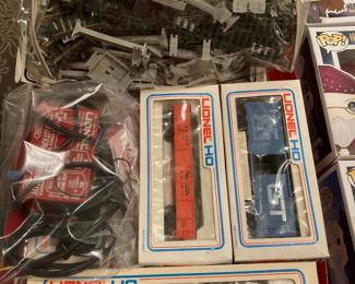 1977 Lionel HO train with engine, cars, track, power, accessories, and brochures