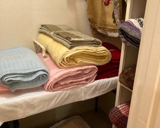 laundered blankets, needlepoint seat covers