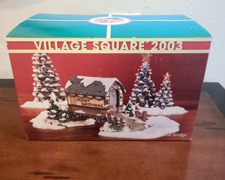 This is a Village Square 2003 covered bridge collectible. 
It is a lighted Christmas holiday village accessory.
The item is part of the "Village Square" series.
The specific model is a snow-covered bridge.
The year 2003 indicates the edition or release year.
Rare Village Square 1992 Vintage Lighted CHRISTMAS


eBay
Victorian Village Collectibles Christmas 2002 Olde Towne ...
I

