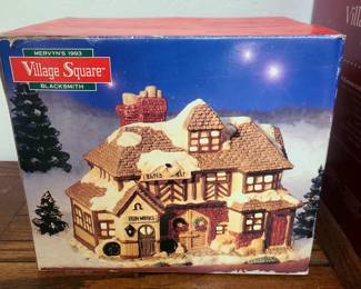This is a Mervyn's Village Square Blacksmith Iron Works Building from 1993. 
It is a hand-painted, illuminated ceramic and porcelain Christmas village building. 
The item includes its original box and a corded light. 
It is a retired piece and considered a nostalgic find for collectors. 
The building features a detailed blacksmith shop with a lit-up furnace. 
Rare Vintage Mervyns Village Square BLACKSMITH ... - eBay
Item description from the seller. Crafted for the holiday enthusiast, the Mervyns Village Square Blacksmith Ironworks is a charmin...

eBay

Mervyn's Village Square Blacksmith Iron Works Building 1993 ...
Item description from the seller The Mervyn's Village Square Blacksmith Iron Works Building is a hand-painted ceramic and porcelai...

eBay

(2) Mervyns Village Square 91,93 Ceramic Light Up Blacksmith, Gen ...
This collectible piece features a detailed blacksmith shop with a lit-up furnace and a general store with a variety of Christmas-t...


