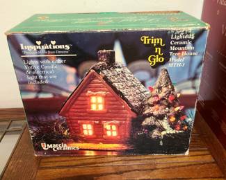 This is a vintage Inspirations Trim 'n Glo lighted ceramic mountain tree house from Marcia Ceramics. 
It is a collectible Christmas decoration, often associated with nostalgia and family traditions from the 1970s and 1980s. 