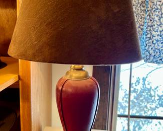 Leather base lamp w/a floral design on the inside of a suede shade